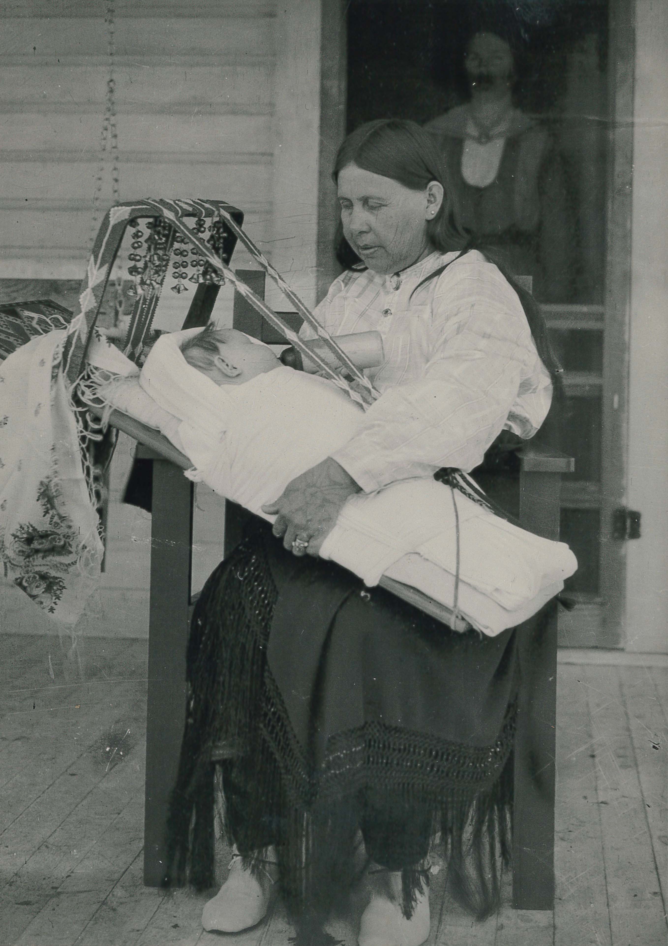 Left to right: Unknown child on cradleboard; Eliza Bigheart Tall Chief [Allottee #341]; Unknown. Osage Nation Museum [P01-0005].