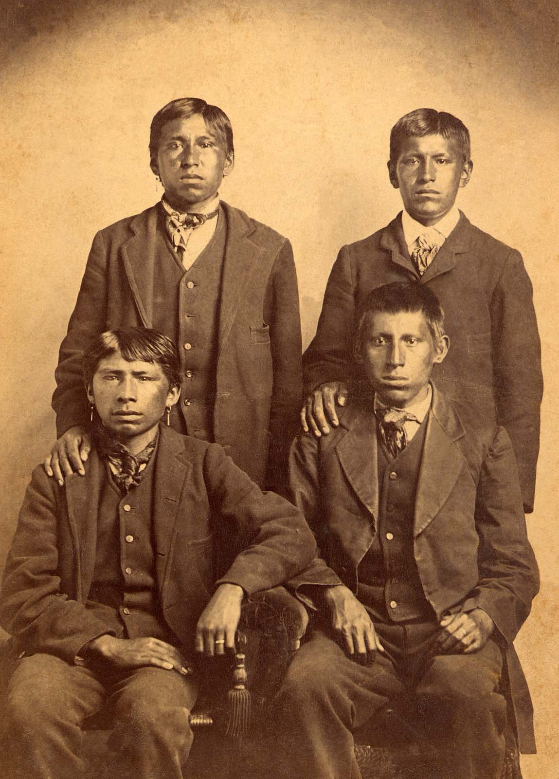 Front row, left to right: Roscoe Conklin [Allottee #140]; Num-pah-q-ah (Theodore R. Harvey) [Allottee #49]. Back row, left to right: Clarence Gray [Allottee #660]; Gurney Miller [Allottee #207]. Osage Nation Museum [P01-0446].