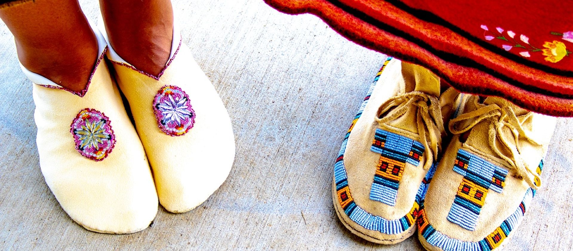 Moccasins worn during the 2021 Pawhuska Inlonshka. The moccasins on the left are traditional Osage moccasins. 