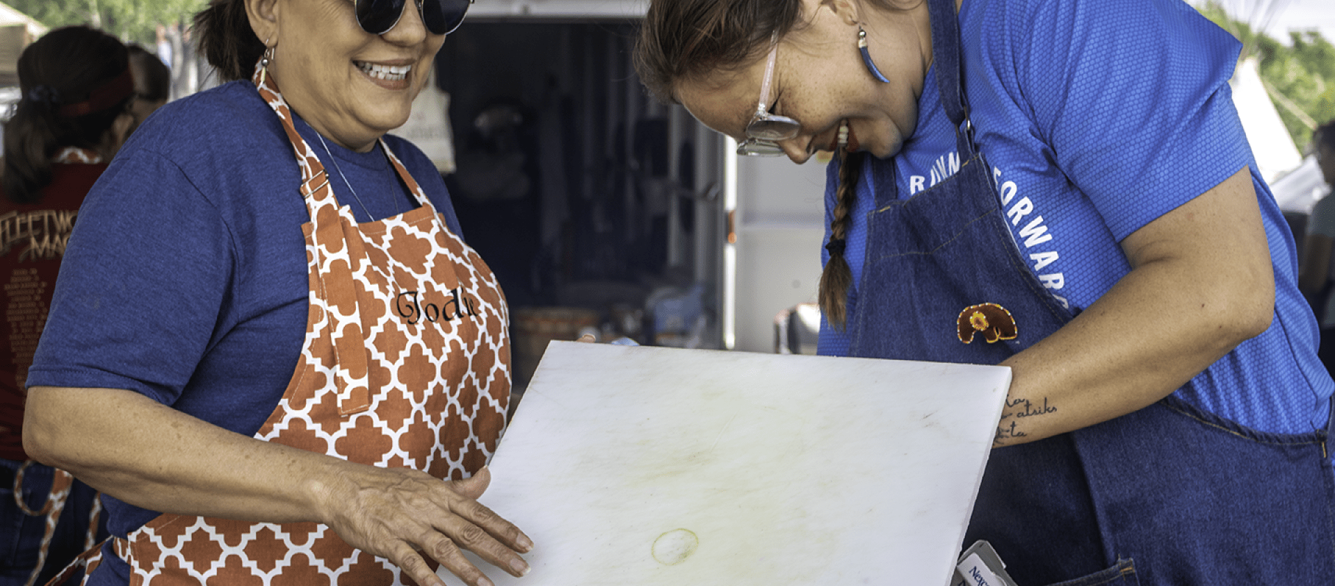 Pawhuska cooks clean up during Grayhorse Inlonshka (2022). 