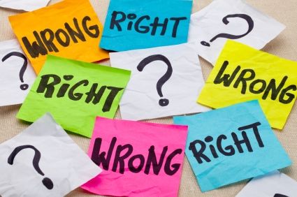 Image shows sticky notes which portray a debate between right and wrong Image shows sticky notes which portray a debate between right and wrong